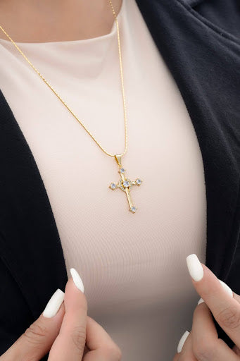 Cross pendant in green or crystal zircons