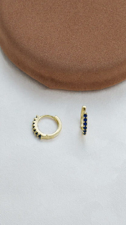 Small blue huggie earrings